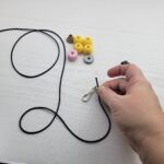 put cord through swivel ring